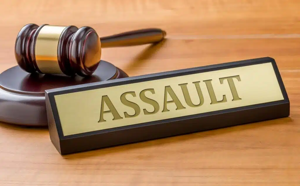 Gavel with a sign that says assault